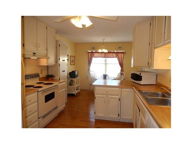Kitchen. Bright cheery kitchen with breakfast bar 
