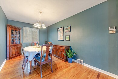 The expansive dining room is flanked with a beautiful built-in cabinet.