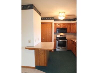 Kitchen has a breakfast bar and pantry.