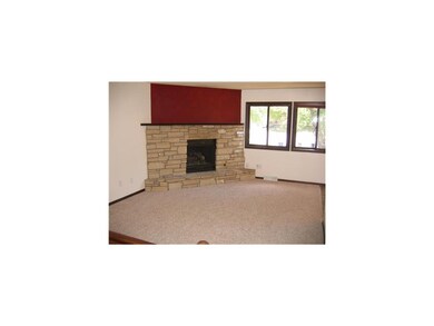 Living Room. Wood burning fireplace with limestone