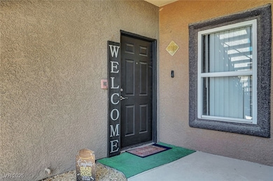 View of exterior entry featuring stucco siding