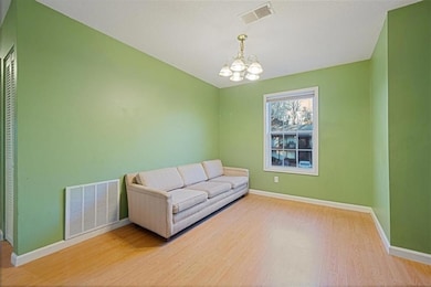 Living area with hardwood / wood-style floors and 