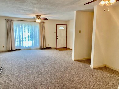 Spacious Picture Window in large living room/dining room combination.