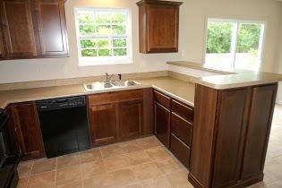 Kitchen with raised bar and end cabinet
