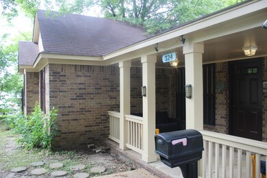 View of exterior entry with a porch