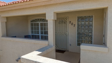 View of exterior entry featuring stucco siding, a