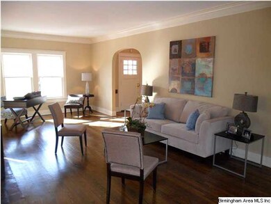 Formal lving room with fireplace and French doors 