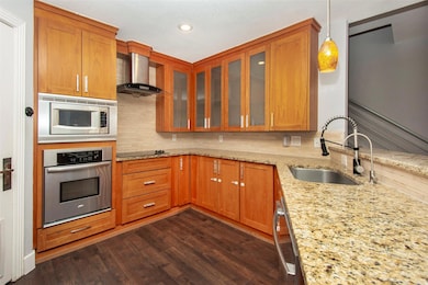 Custom storage in kitchen including drawers