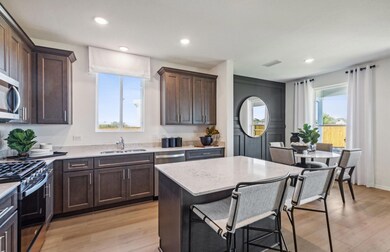 Spacious kitchen with oversized island  *Photos of