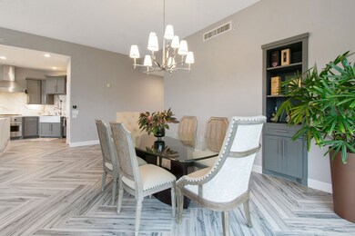 Formal dinning area accented by modern travertine