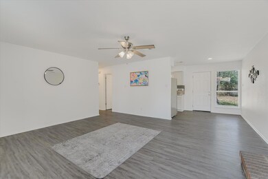 Unfurnished living room featuring ceiling fan, da