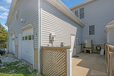 Front Elevation Outdoor Shower and Garage