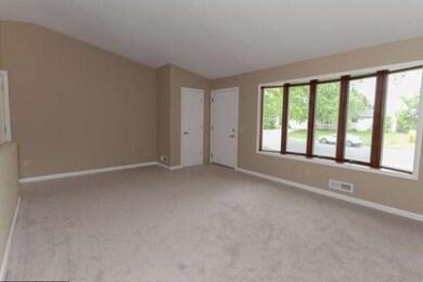 The large main floor living room has vaulted ceili
