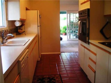 Mid century kitchen with cooktop and wall oven.
