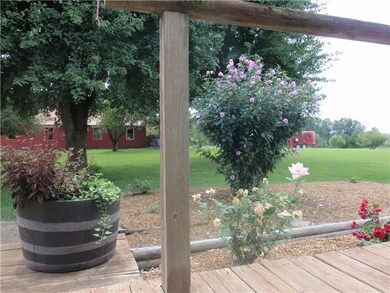 View of Barn from Deck....Just Bee-Bop on over and visit your 4-legged Friends!  Nice level yard for the children to play.