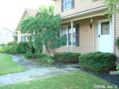Exterior Front. Established landscaping adds to th