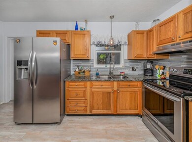You'll appreciate the wood cabinetry, stainless-st