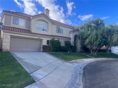 Mediterranean / spanish-style house with stucco siding, an attached garage, a front lawn, and a chimney