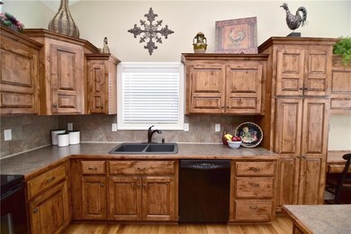 Custom cabinets include a pantry, deep drawers, a 