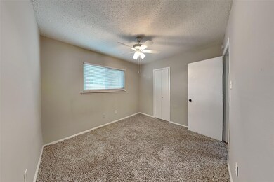 Unfurnished bedroom with ceiling fan, carpet, and 