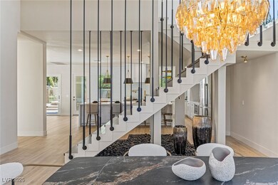 Stairs featuring baseboards, wood finished floors,