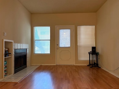 Entryway featuring light wood-style flooring, a t