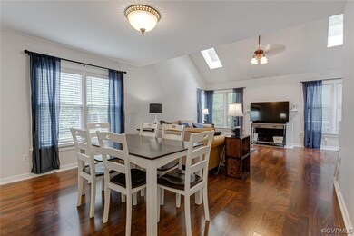 Dining room featuring dark hardwood flooring, loft