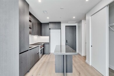 Kitchen featuring modern cabinets, a kitchen isla
