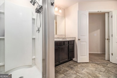 Upstairs, retreat to the Primary Suite with a Walk-In Closet and Private Ensuite Bath complete with a Dual Vanity and Shower