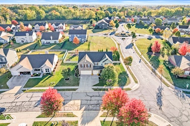 From a distance, this aerial pic allows one to appreciate the surroundings of this coveted corner lot.