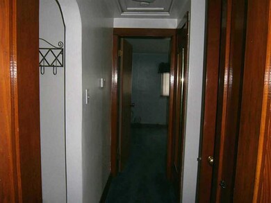 Interior Space/Layout. Hallway between the bedroom