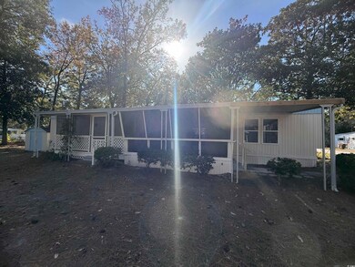 View of front of house featuring a sunroom