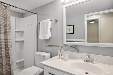 Bathroom with vanity and curtained shower