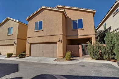 BACK VIEW WITH 2 CAR AND PATIO