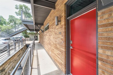Property entrance featuring brick siding