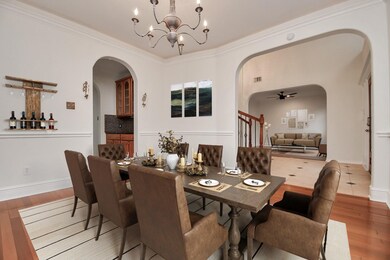 Elegant formal living room with large windows and