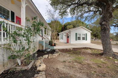 View of home's exterior featuring an outbuilding 