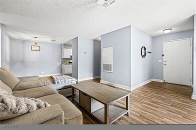 Spacious living room with view of the front foyer