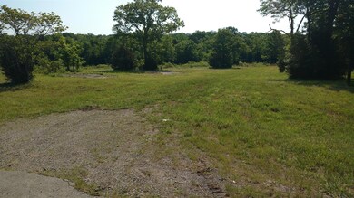 Another Picture fron the drive way along the front of property looking toward the East