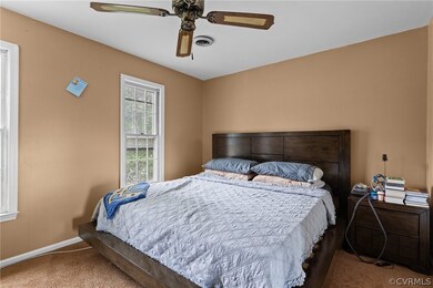 Bedroom featuring carpet flooring and ceiling fan