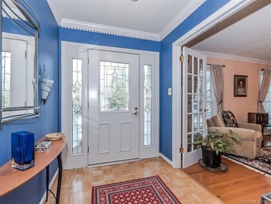 Entry Foyer with decorative glass front door, dent