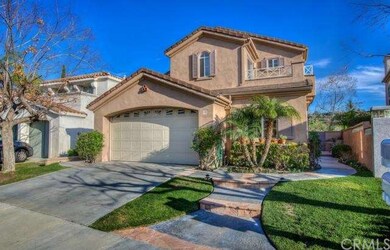 Brick accents and tropical landscaping add to the 