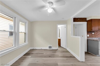 Unfurnished dining area featuring ceiling fan and light hardwood / wood-style floors