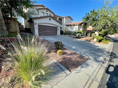 Mediterranean / spanish house featuring driveway,