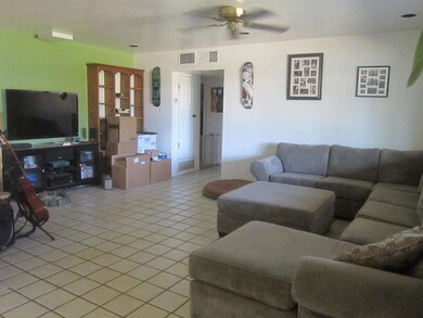 living room shows green wall fan
