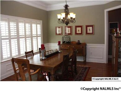 Dining Room, Hardwood Floors, Wainscoteing, Planation Shutters.