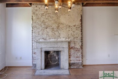 Exposed brick and fireplace in the penthouse #D