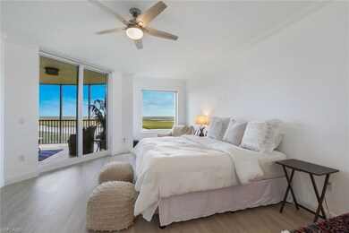Bedroom featuring a ceiling fan, ornamental moldin