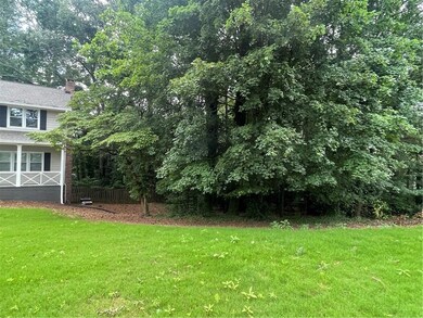 Lot to right of house in picture.
