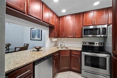 Kitchen featuring stainless steel appliances, ligh
